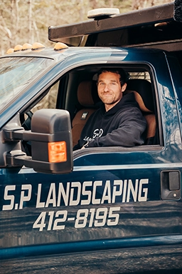 About S.P. Landscaping - Shannon in truck - Owner